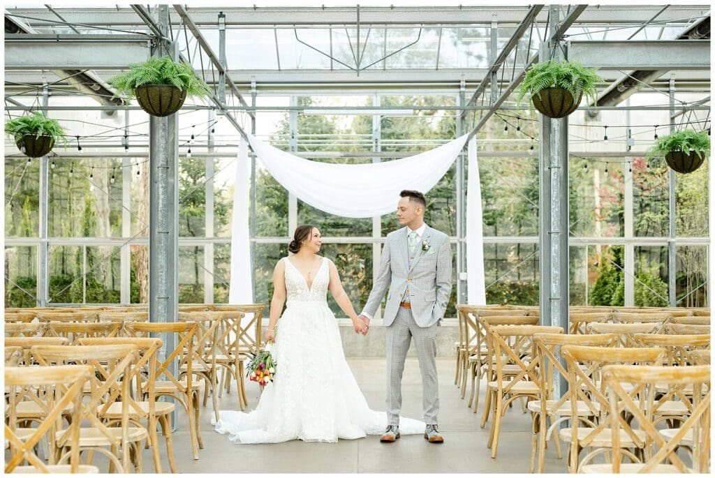 bride and groom, Saugatuck Michigan, spring wedding, tulip bouquet, wedding photos, ivy house venue, green house