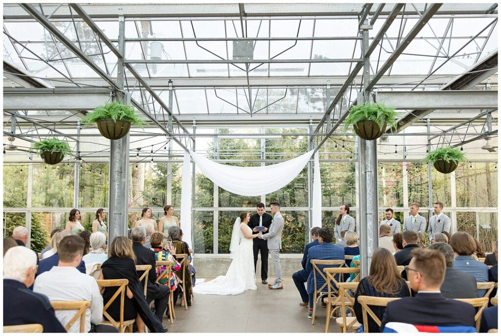 bride and groom, Saugatuck Michigan, spring wedding, tulip bouquet, wedding photos, ivy house venue, green house