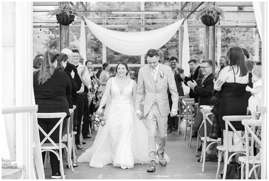 bride and groom, Saugatuck Michigan, spring wedding, tulip bouquet, wedding photos, ivy house venue, green house